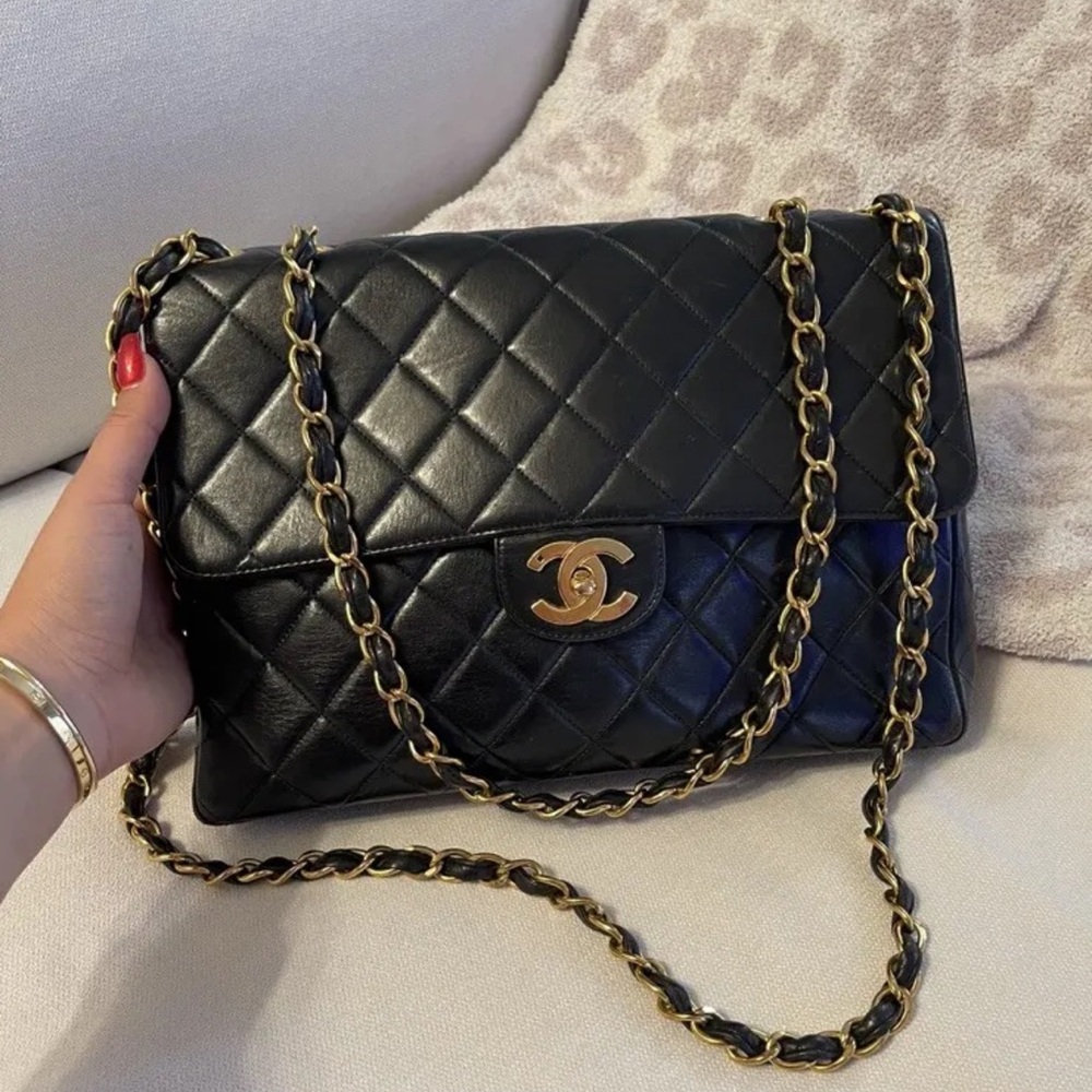 Chanel jumbo lambskin gold hardware black flap bag
